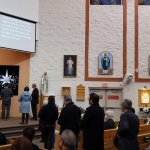 Richmond, BC: Participants take turns pinning stars to a blue cloth as a sign of their desire for unity at St. Monica Parish. This was one of several WPCU events organized in and around Vancouver, BC, in 2022.